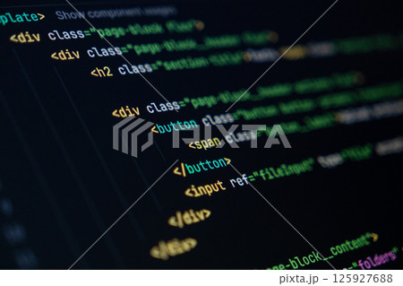 close-up of computer screen with colorful html code, focus on div and button elements, web development and frontend design 125927688