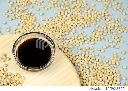 Close-Up of Soy Sauce and Scattered Soybeans Close-Up of Soy Sauce and Scattered Soybeans 125928235