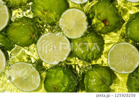 Fresh Lime Halves Floating in Water Top View Fresh Lime Halves Floating in Water Top View 125928250