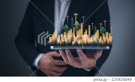 Businessman hand holding upward bar chart with glowing arrows, showing business growth, Investment analysis in digital economy, Goal success concept with increasing development profit graph. 125928849