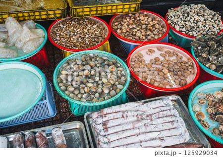 assortment of shellfish and squid at fish seafood street market in Vietnam in Asia assortment of shellfish and squid at fish seafood street market in Vietnam in Asia 125929034