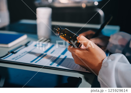 Male and female doctors are having a meeting in a hospital room. 125929614