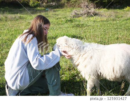 teenage girl with sheep outside on rancho, lifestyle people teenage girl with sheep outside on rancho, lifestyle people 125931427