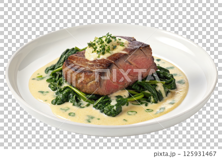 Seared Steak with Creamy Spinach Sauce on a White Plate Seared Steak with Creamy Spinach Sauce on a White Plate 125931467