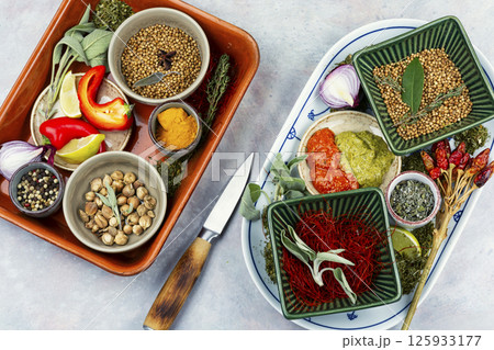Bowls with various spices. 125933177