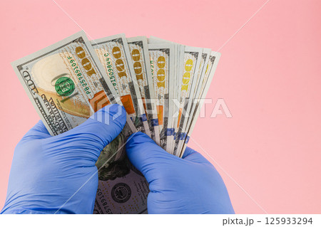 Foot care procedure with medical gloves on patients toes Foot care procedure with medical gloves on patients toes 125933294