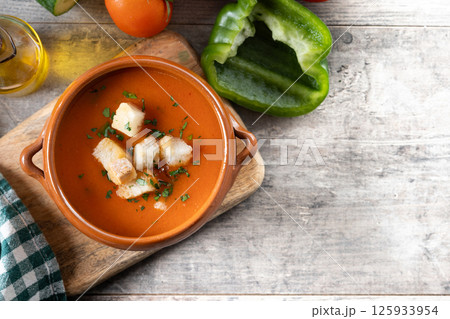 Traditional Spanish Gazpacho soup on wooden table. Top view. Copy space Traditional Spanish Gazpacho soup on wooden table. Top view. Copy space 125933954