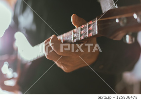 Close up hand playing Thai Mandolin Close up hand playing Thai Mandolin 125936478