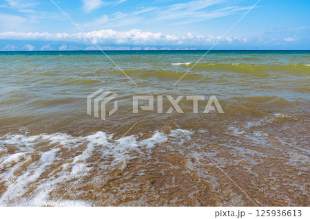 Gradient of water color near sandy coast 125936613