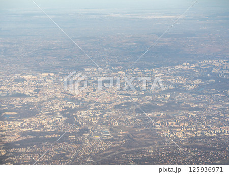 Plane window view of snow Polish fields and villages, Krakow suburbs, aircraft fly landscape Plane window view of snow Polish fields and villages, Krakow suburbs, aircraft fly landscape 125936971