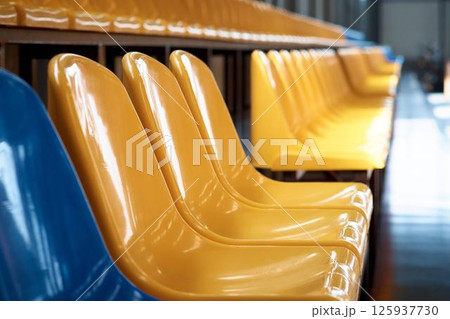 A grandstand at a hippodrome for horse racing. Rows of seats in a stadium A grandstand at a hippodrome for horse racing. Rows of seats in a stadium 125937730