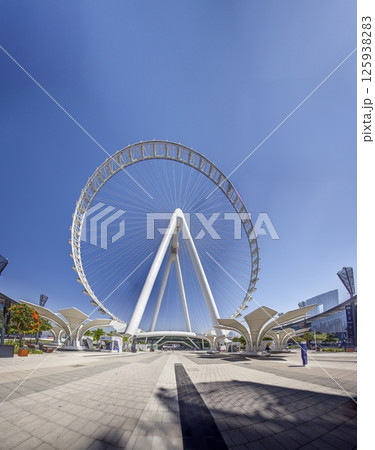 Dubai Eye giant Ferris wheel under blue sky Dubai Eye giant Ferris wheel under blue sky 125938283