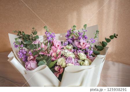 A large colorful delicate bouquet in a gift box with a copy space. 125938291
