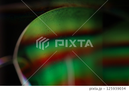 Green liquid surface on dark background, green Reflections of liquid in macro, green liquid surface, bubbles in macro, connection of bubbles in macro, cell from liquid, dark background, glossy surface Green liquid surface on dark background, green Reflections of liquid in macro, green liquid surface, bubbles in macro, connection of bubbles in macro, cell from liquid, dark background, glossy surface 125939034