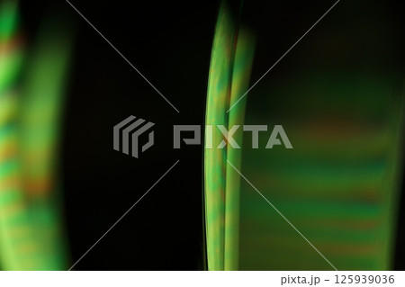 Green liquid surface on dark background, green Reflections of liquid in macro, green liquid surface, bubbles in macro, connection of bubbles in macro, cell from liquid, dark background, glossy surface Green liquid surface on dark background, green Reflections of liquid in macro, green liquid surface, bubbles in macro, connection of bubbles in macro, cell from liquid, dark background, glossy surface 125939036
