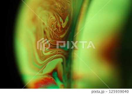 Green liquid surface on dark background, green Reflections of liquid in macro, green liquid surface, bubbles in macro, connection of bubbles in macro, cell from liquid, dark background, glossy surface Green liquid surface on dark background, green Reflections of liquid in macro, green liquid surface, bubbles in macro, connection of bubbles in macro, cell from liquid, dark background, glossy surface 125939040