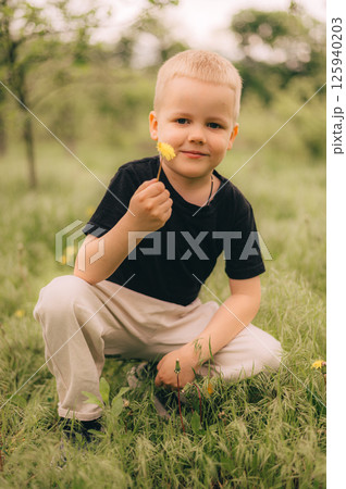 Child Holding Flower in Meadow Showing Happiness 125940203