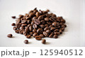 Roasted coffee beans pile from top on white background 125940512