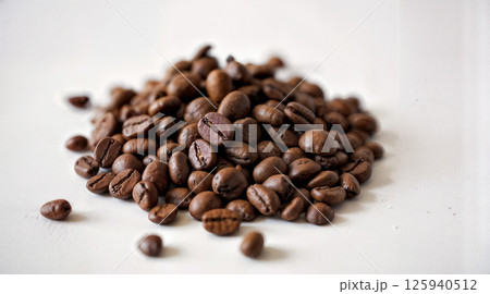 Roasted coffee beans pile from top on white background Roasted coffee beans pile from top on white background 125940512