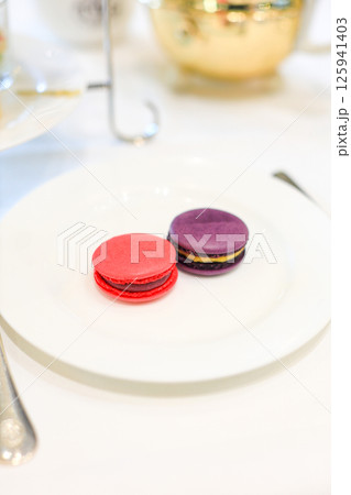 Dessert, cake, canape, macarons and sweets to accompany afternoon tea. Dessert, cake, canape, macarons and sweets to accompany afternoon tea. 125941403