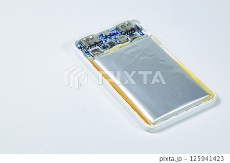 damaged swollen Lithium polymer, Li-ion batteries for mobile device isolated on white background. damaged swollen Lithium polymer, Li-ion batteries for mobile device isolated on white background. 125941423