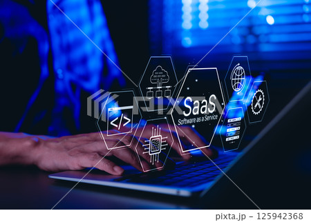 SaaS Software as a Service Concept. Man using laptop with futuristic interface SaaS (Software as a Service) icons, cloud computing, solutions, software development elements, modern technology platform SaaS Software as a Service Concept. Man using laptop with futuristic interface SaaS (Software as a Service) icons, cloud computing, solutions, software development elements, modern technology platform 125942368