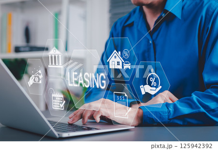 Leasing and Financial Service Concept. Businessman using laptop with icons related to leasing, finance, housing, automotive, interest rates, and monthly payments. lease agreement, leasing car, 125942392