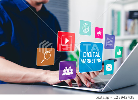 Digital Marketing Strategy Concept. A person using laptop with digital marketing icons representing SEO SEM SMM, video, email, web, advertising, ad, social media, shopping online, and analytics tools. Digital Marketing Strategy Concept. A person using laptop with digital marketing icons representing SEO SEM SMM, video, email, web, advertising, ad, social media, shopping online, and analytics tools. 125942439