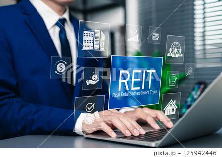 REIT, Real Estate Investment Trust Financial Concept. Businessman using laptop with REIT investment icons. property, finance charts, growth, mutual fund, investor, return, and income strategy. REIT, Real Estate Investment Trust Financial Concept. Businessman using laptop with REIT investment icons. property, finance charts, growth, mutual fund, investor, return, and income strategy. 125942446