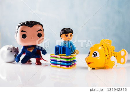 Plastic construction set boy, yellow plastic fish, magnetic construction set parts, superhero figure.  125942856
