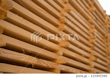 Diagonal closeup of wooden board edges showing saw marks and fibers Diagonal closeup of wooden board edges showing saw marks and fibers 125945560
