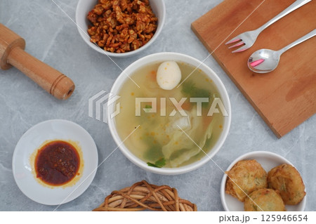 a traditional Indonesian meal served on a grey marble surface 125946654
