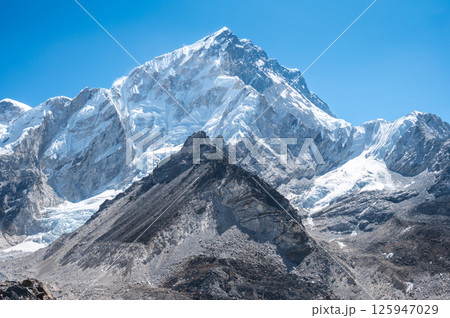 Beautiful view of Mt.Nuptse (7,861 m) on the way to Everest base camp in Nepal. Mount Nuptse is a majestic neighbor to the world's highest peak, Mount Everest. Beautiful view of Mt.Nuptse (7,861 m) on the way to Everest base camp in Nepal. Mount Nuptse is a majestic neighbor to the world's highest peak, Mount Everest. 125947029
