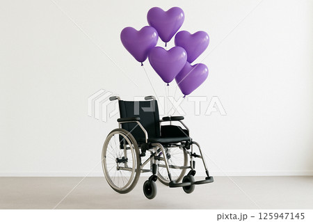 Wheelchair floating with purple heart balloons 125947145