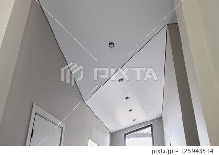 A Modern Hallway Ceiling design with integrated Recessed Lighting for effective illumination A Modern Hallway Ceiling design with integrated Recessed Lighting for effective illumination 125948514
