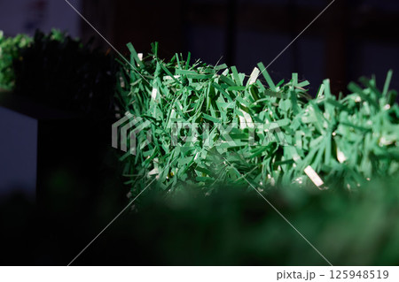 The Texture of Artificial Grass Displayed in Soft Natural Lighting for Enhanced Visual Appeal 125948519