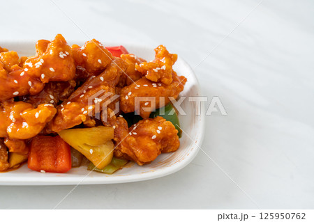 fried crispy chicken with sweet and sour sauce 125950762