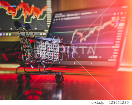 Real estate investment concept with shopping cart and stock market chart 125951229