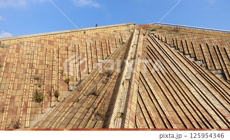 A glimpse of one of the brick pyramids in Naples just outside the city center. 125954346