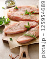 Meat. Raw turkey tenderloin meat, turkey steaks with ingredients for cooking 125954689