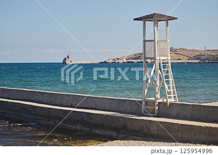 Wooden tower for observation of the beach on the seashore 125954996