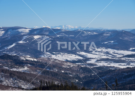Tatra mountains from Silesian Beskid on European Bialy Krzyz in Poland Tatra mountains from Silesian Beskid on European Bialy Krzyz in Poland 125955904