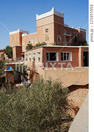Orange building in African Tafraout town in Morocco - vertical Orange building in African Tafraout town in Morocco - vertical 125955958