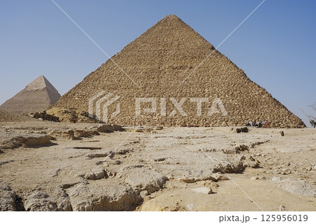 Scenic pyramids of Cheops and Chephren in African Giza city near Cairo in Egypt Scenic pyramids of Cheops and Chephren in African Giza city near Cairo in Egypt 125956019