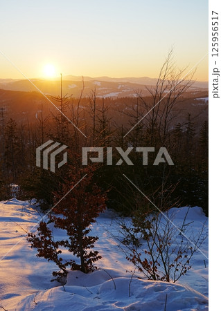 Beauty sun set at Silesian Beskid on European Bialy Krzyz in Poland - vertical 125956517