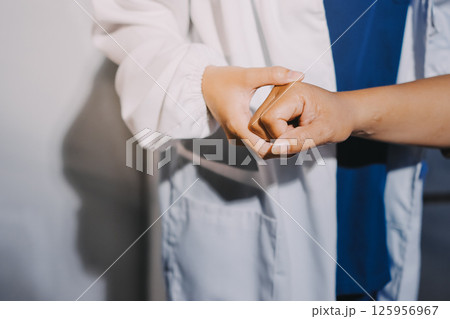 Orthopedist examining patient in hospital Orthopedist examining patient in hospital 125956967