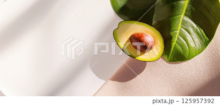 Close-up view of a perfectly ripe avocado half showcasing its smooth texture and vibrant colors 125957392