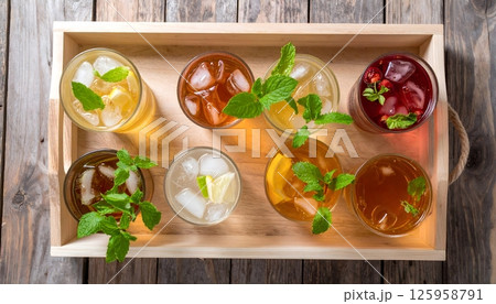 Various Refreshing Iced Teas with Fruits and Herbs Top View 125958791