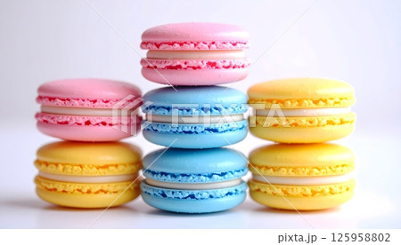 Beautiful Stack of Colorful Macarons on White Background 125958802