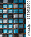 Wooden grid with colorful weathered blue and white panels, background, texture 125958900
